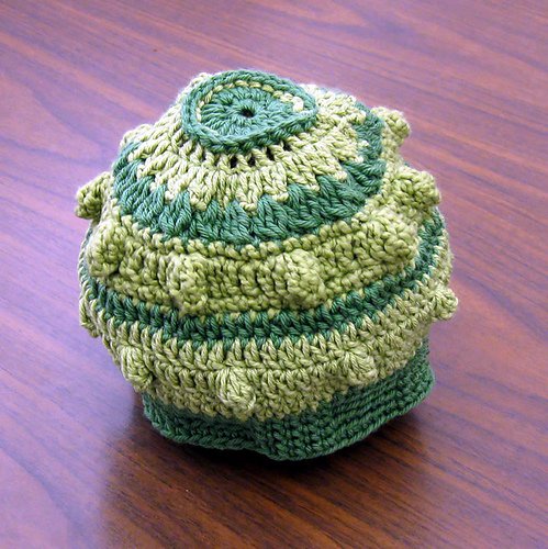 Summertime Baby Hat — a textured green crocheted baby hat with bobble detail